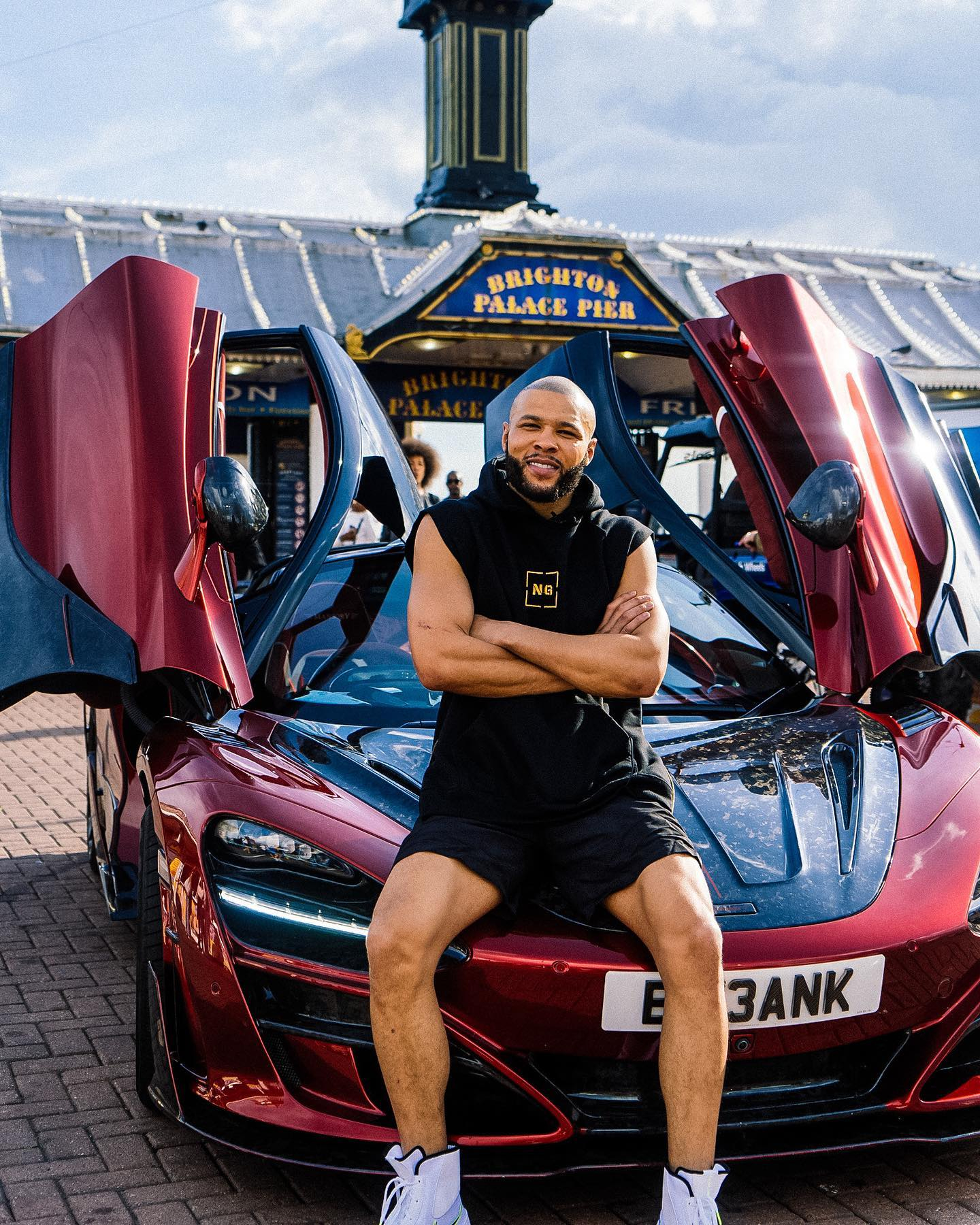 Eubank Jr poses with his Mclaren 720s on Brighton Palace Pier